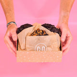 Hands holding a box of 3 x New York Cookies, The Dark Chocolate Lovers Box by Crumbs & Doilies